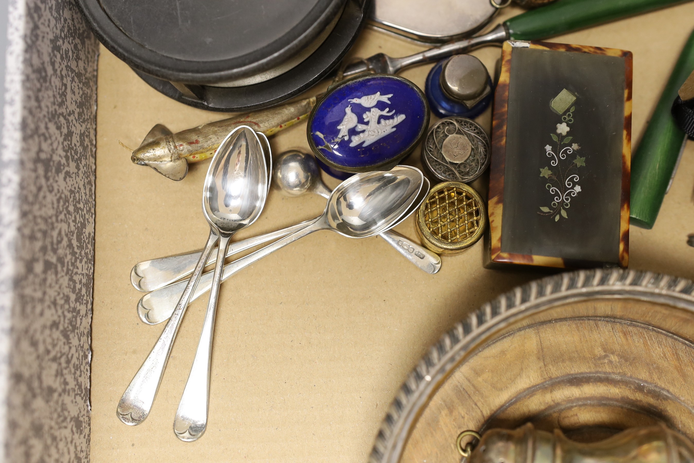 A mother-of-pearl sewing case, various charms and spoons etc